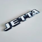 Original white Jetta Mk2 rear badge. Brand new.